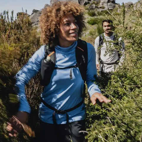 women hiking in a blue outdoor shirt
