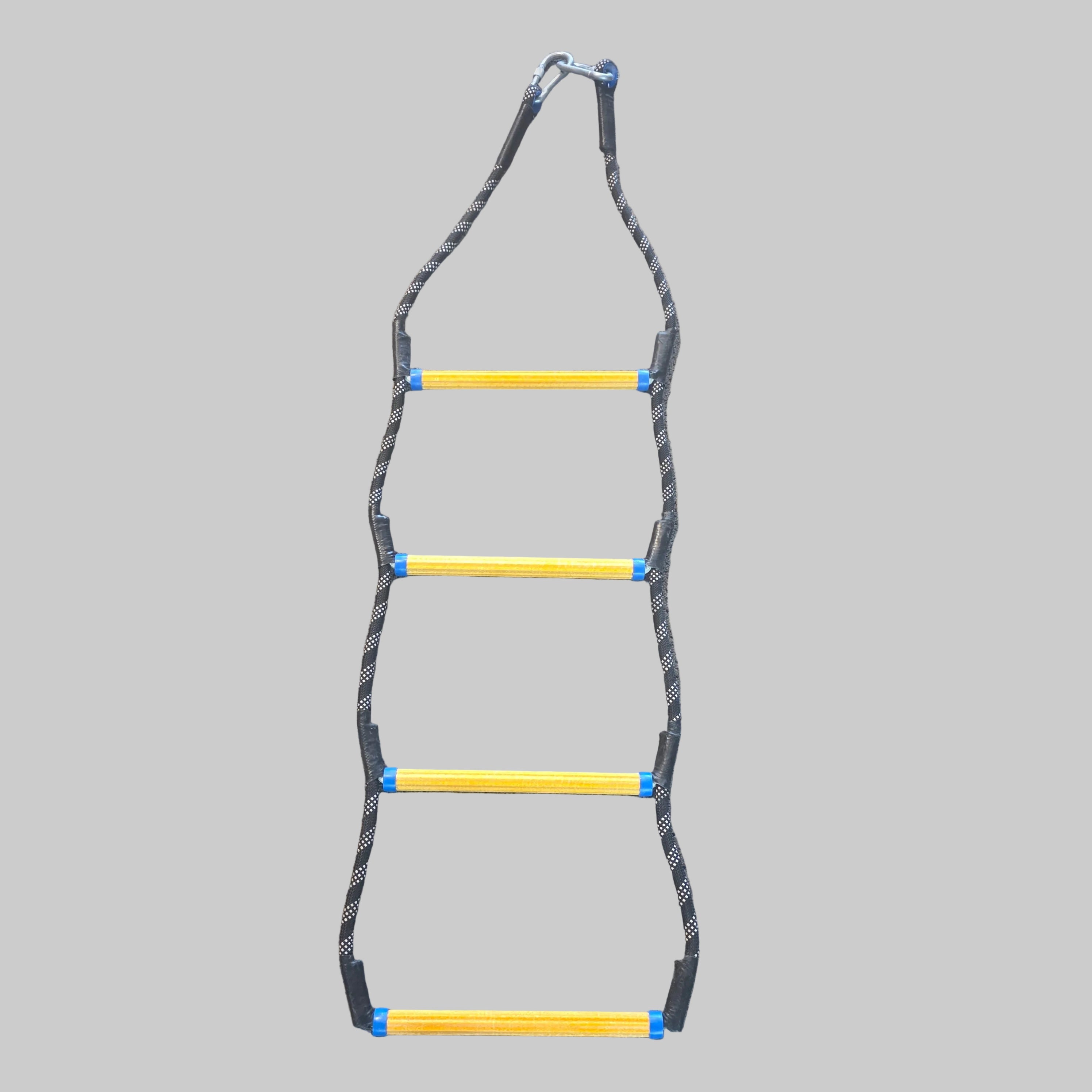 A vertical agility ladder with four yellow steps wrapped in black tape, suspended from a metal carabiner on a textured brown carpet.