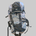 A Mizuno hiking backpack in gray and black, laid flat on a textured beige carpet.