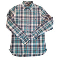 A long-sleeve plaid button-up shirt laid flat on a textured brown carpet. The shirt features a blue, green, white, and black plaid pattern.