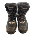 A pair of Columbia 900grams mid-calf hiking boots in black and gray, shown from the front on a dark gray floor.