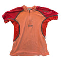 Front of coral and red Salomon women's cycling jersey
