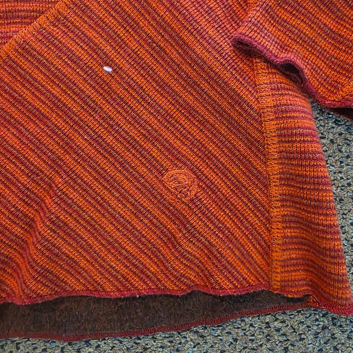 Embroidered logo and fabric detail