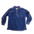 A dark blue corduroy long-sleeve button-up shirt laid flat on a beige carpeted floor.