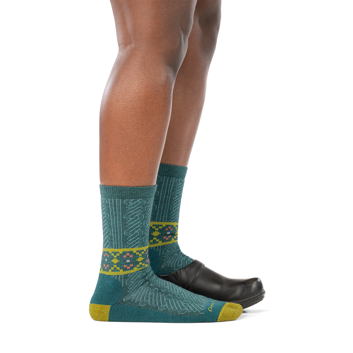 Darn Tough Nordic Twist Crew Lightweight Cushion Women's sock in Teal, worn with shoe