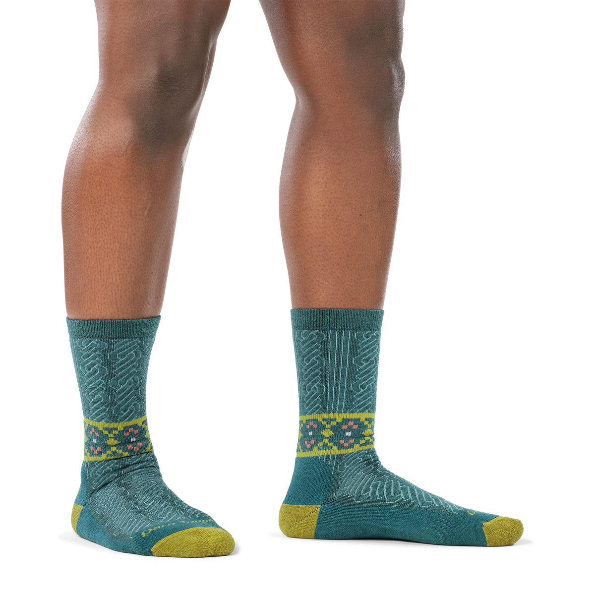 Darn Tough Nordic Twist Crew Lightweight Cushion Women's sock in Teal, worn on foot