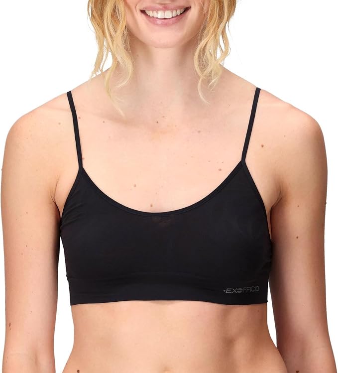 A woman wearing a black ExOfficio sports bra against a plain white background.