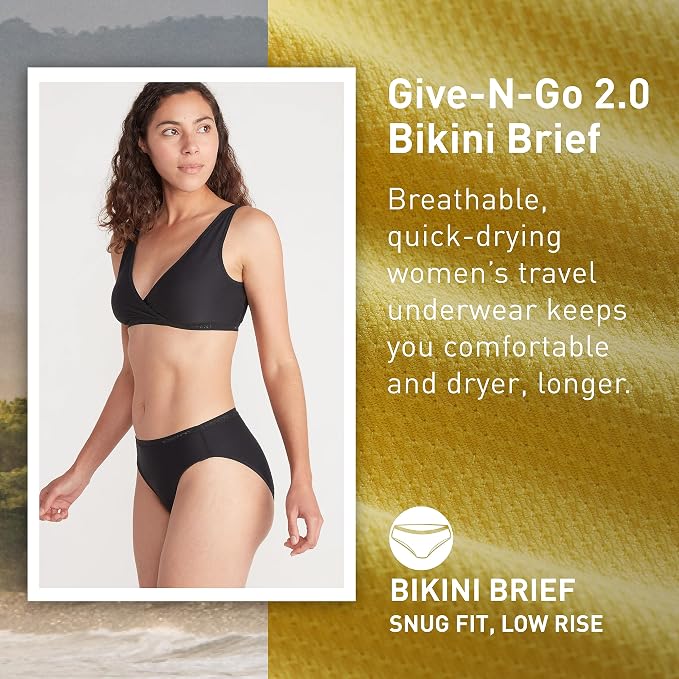 Woman wearing a black bikini brief with product description text on a beach background