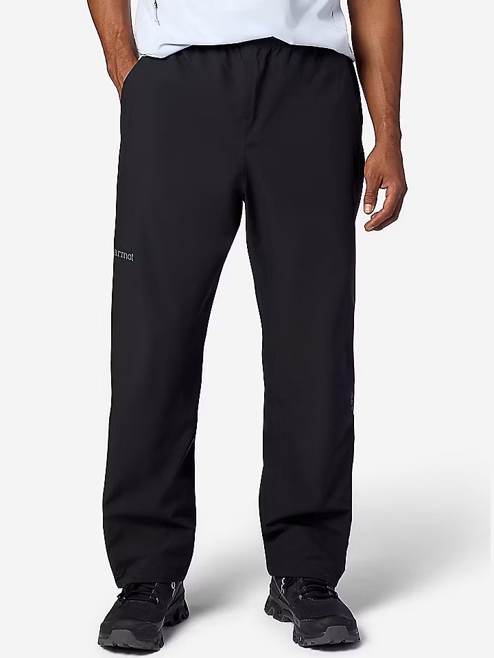 Person wearing black pants on a white background